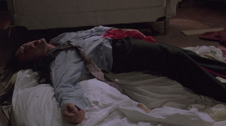 Johnny (Tommy Wiseau) lying on a bed in The Room