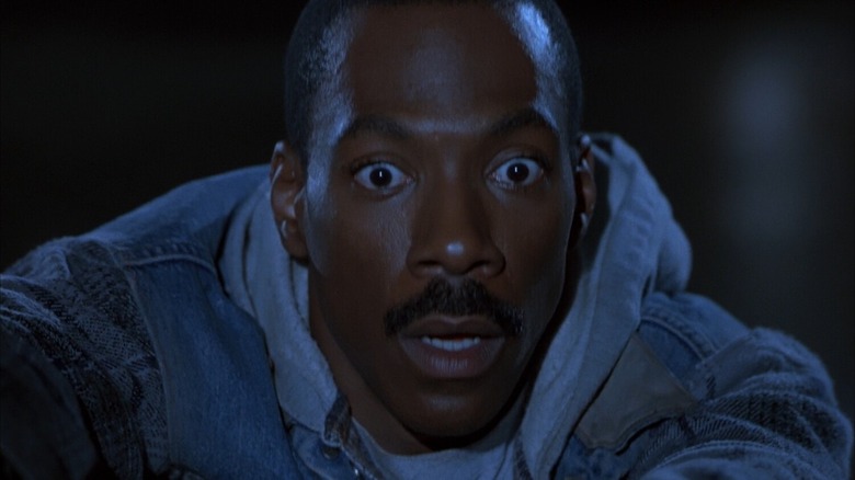 Eddie Murphy looking surprised as Axel Foley in Beverly Hills Cop III