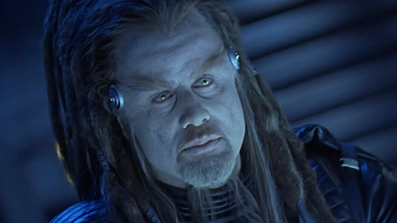 Terl (John Travolta) glaring at someone in Battlefield Earth