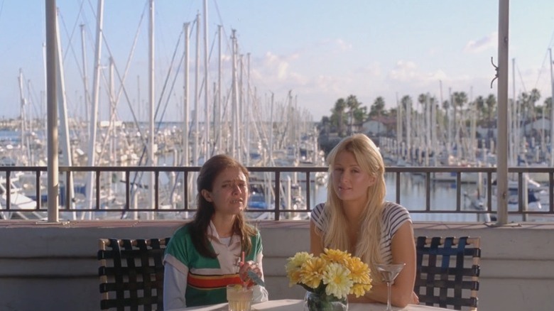 Christine Lakin as June and Paris Hilton as Cristabel sitting at a table in The Hottie and the Nottie