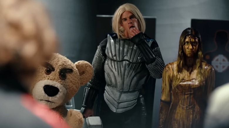 Teddy, Mark Harley as Thor, and Caitlin Wachs as Scary staring menacingly in the training arena in The Hungover Games