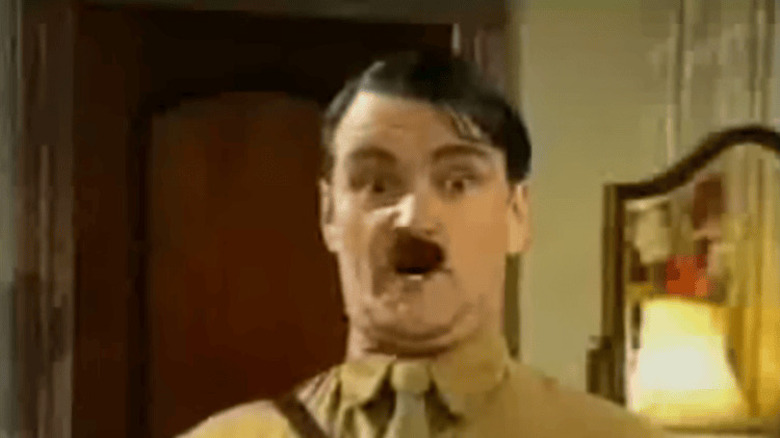 Adolf Hitler (Neil McCaul) surprised in Heil Honey I'm Home
