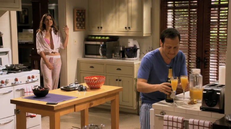 Rob (Rob Schneider) making mimosas for Maggie (Claudia Bassols) in Rob