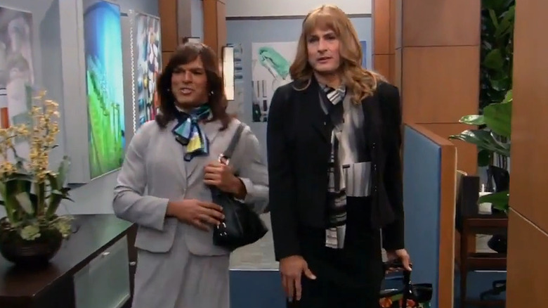 Lee (Ben Koldyke) and Angel (Amaury Nolasco) walking through office in Work It