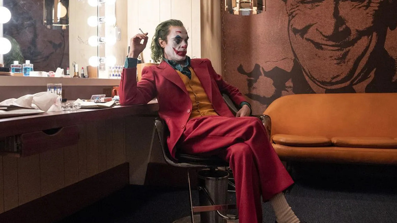 Joaquin Phoenix as the Joker, sitting in his dressing room on Murray's show in the film Joker