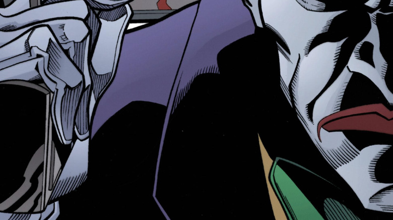 The Joker walks away from Gordon's wife, dead and surrounded by infants