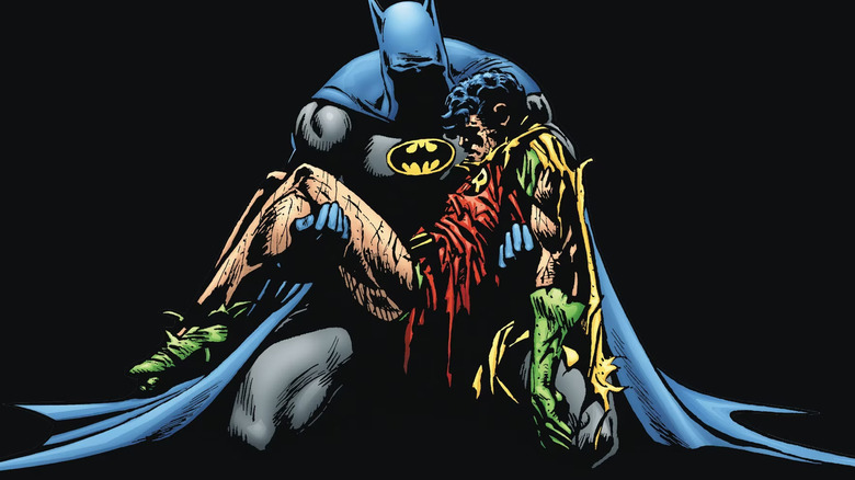 Batman cradles the corpse of Jason Todd