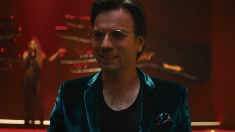 Roman smiling in nightclub Birds of Prey