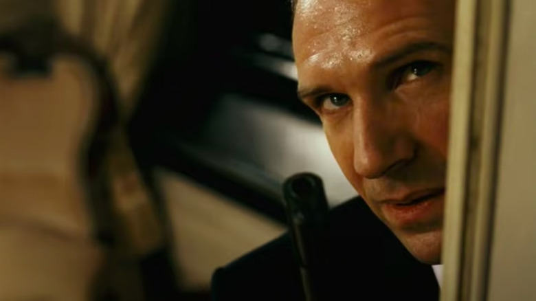 Ralph Fiennes peeks around doorway