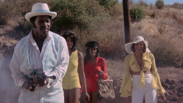 Dolemite brandishing gun