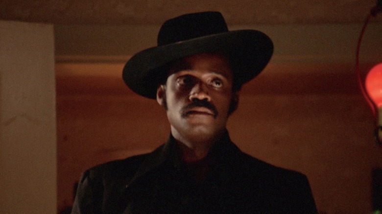 Sweetback wearing hat