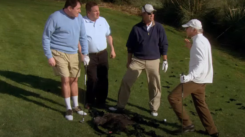 Larry David standing over dead swan