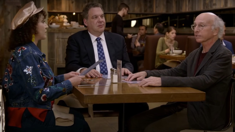 Larry, Jeff, and Susie sitting in restaurant