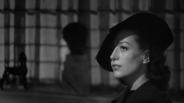 crawford wearing large hat