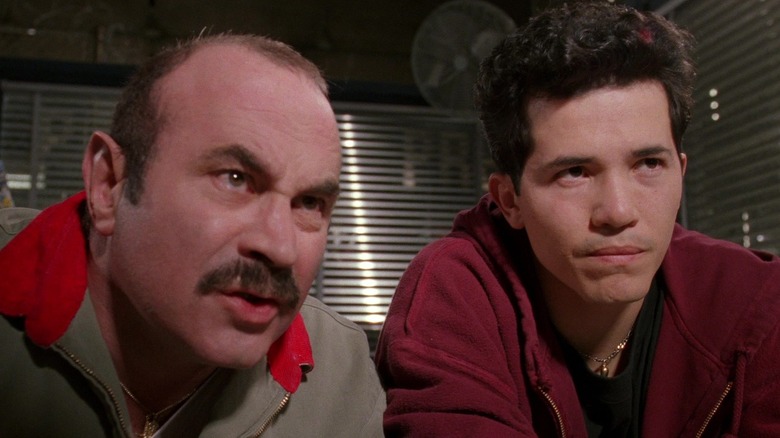 Bob Hoskins as Mario and John Leguizamo as Luigi look puzzled in Super Mario Bros.
