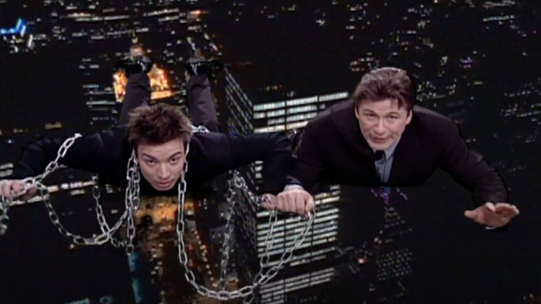 Jimmy Fallon, in chains, and Alec Baldwin fly into the future for a 2011 SNL episode