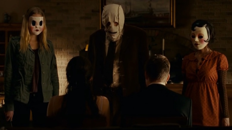 Masked figures