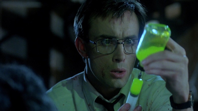 Herbert West with a vial of his serum
