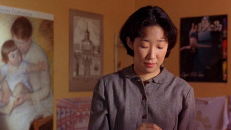 Sandra Oh looking down