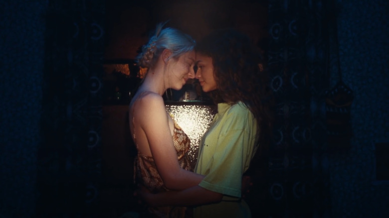 Jules and Rue sharing a tender embrace in a flash of light on Euphoria