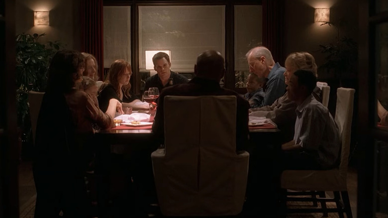 David Fischer, sitting at the head of a full dinner table on Six Feet Under