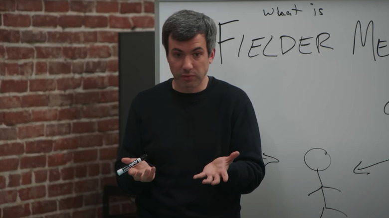 Nathan Fielder playing himself and standing in front of a white board that reads "What is the Fielder Method?" on The Rehearsal