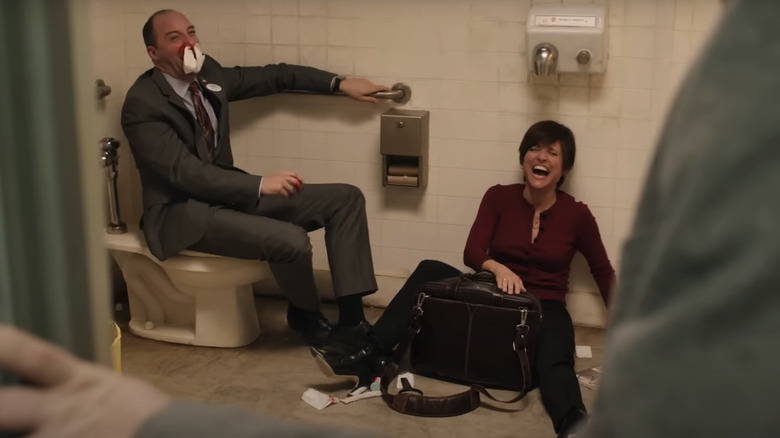 Gary and Selina, laughing together on the floor of a dirty bathroom on Veep