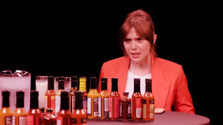 Elizabeth Olsen glares