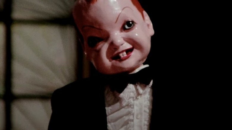 deep red dario argento evil ventriloquist dummy smiles