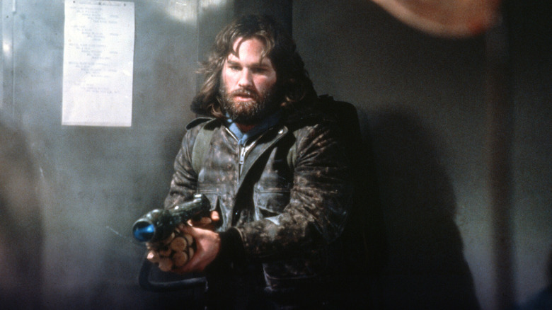 Kurt Russell with flamethrower