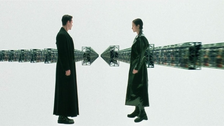 Keanu Reeves and Carrie-Anne Moss talking