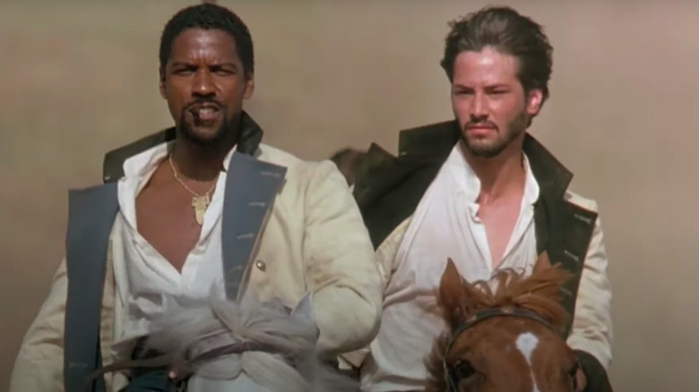 Denzel Washington and Keanu Reeves riding horses