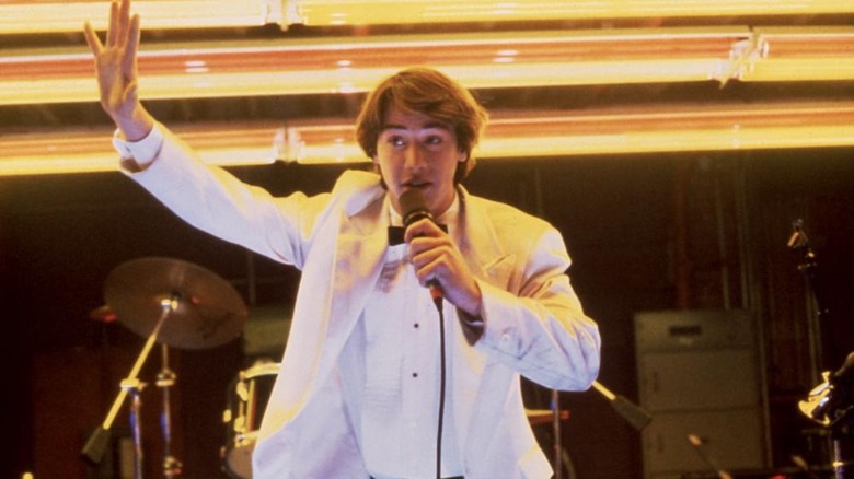Keanu Reeves on stage with microphone