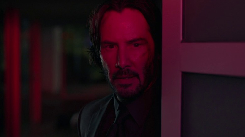 Keanu Reeves in neon lighting