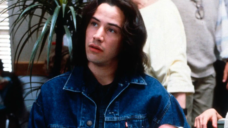 Keanu Reeves holding a baby
