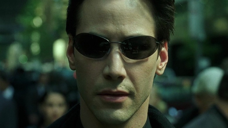 Neo wearing sunglasses