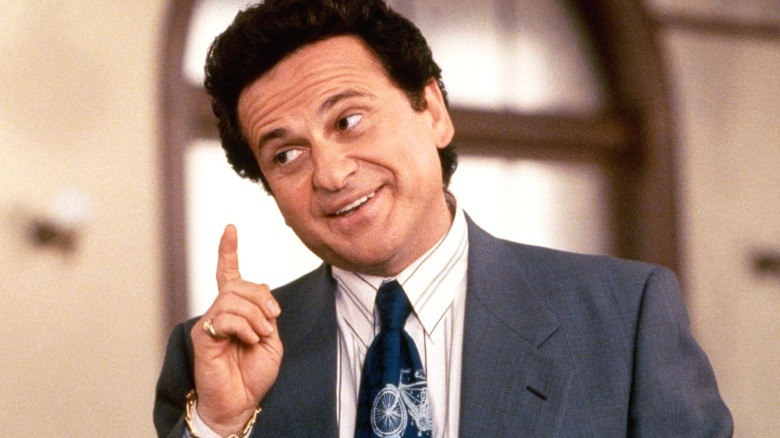 Joe Pesci wearing a suit and tie