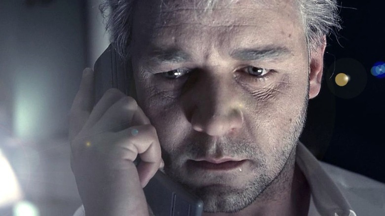 Russell Crowe listens on the phone.