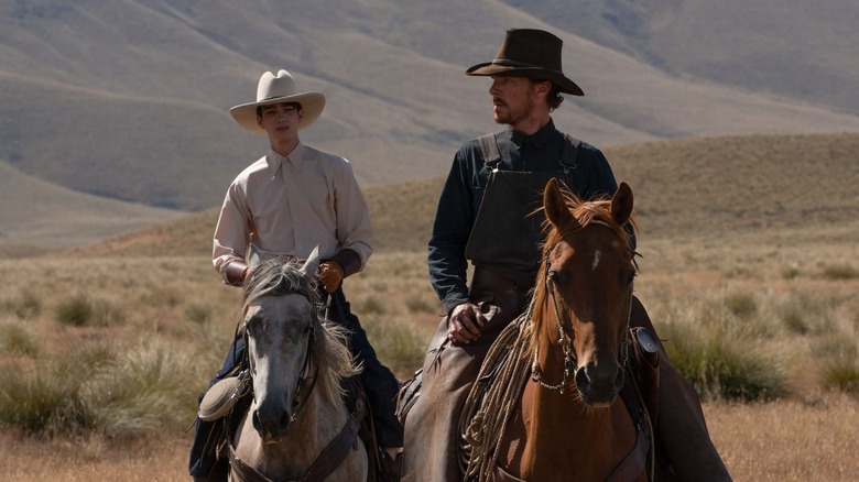 Cumberbatch and Smit-McPhee on horseback