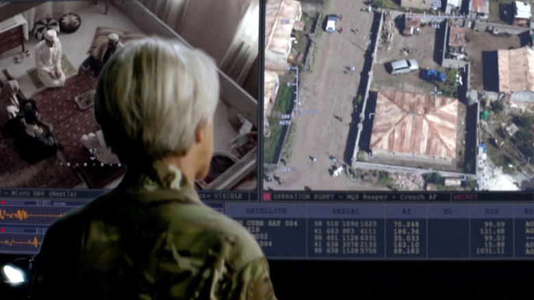 Helen Mirren watches video screen
