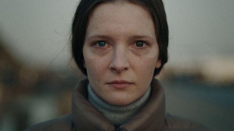 Maud (Morfydd Clark) stares at camera in Saint Maud