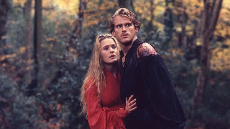 Buttercup and Westley standing disheveled in the woods.