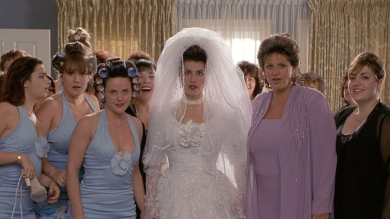 Toula in a bridal gown stares in horror with her bridal party around her.