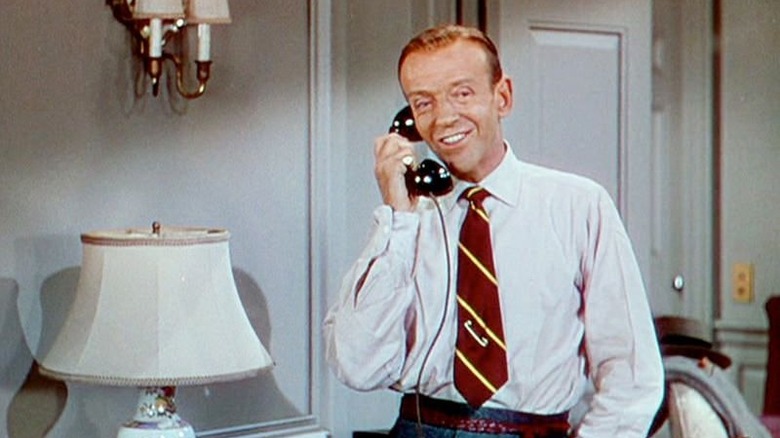 Tom Bowen smiles as he speaks on the telephone.