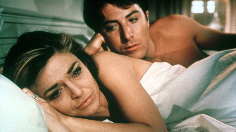Benjamin Braddock in bed with a teary-eyed Mrs. Robinson.