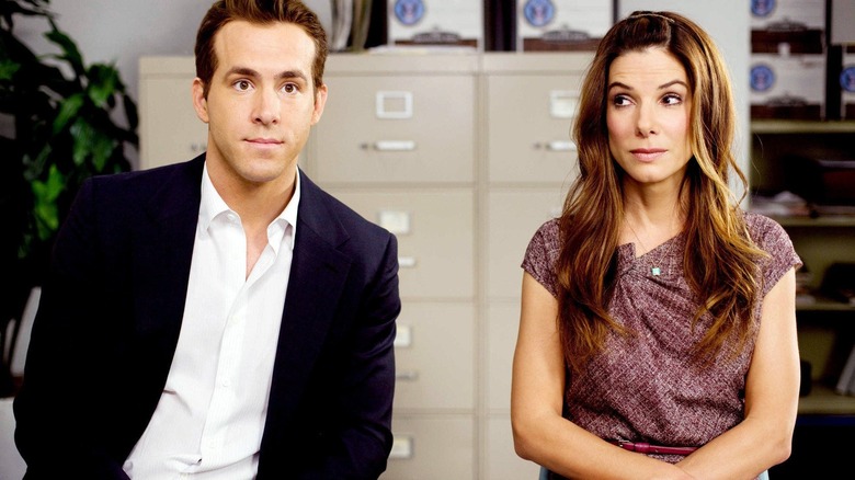 Margaret Tate and Andrew Paxton sit awkwardly in an office.