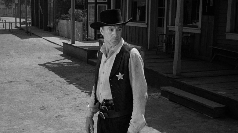 Gary Cooper alone on street