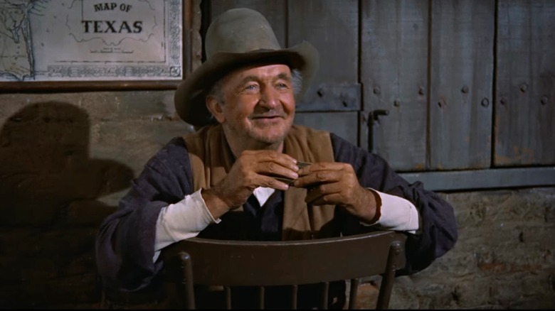 Walter Brennan plays harmonica