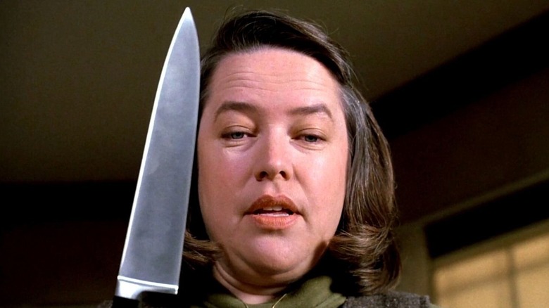 Kathy Bates as Annie Wilkes, holding a kitchen knife in Misery