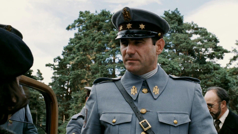 Sergi Lopez as Captain Vidal stares at Ofelia outside of a car in Pan's Labyrinth